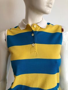 Vintage MISSONI sport by Malerba striped top. Wide stripes in yellow and blue with a white collar, very preppy/hipster sleeveless blouse.  Great for everyday summer style.  Logo on the side.  Brand - MISSONI sport by Malerba  Made in Italy  Material - cotton  Size - XS / Italian  Appr. Measurements:  ( taken when blouse lying flat, double armpit to armpit and bottom ): Shoulder to Shoulder (from seam to seam) - 14 inches / 35.56 cm Shoulder - 5 inches / 12.18 cm Armpit to armpit - 17 inches / 43 Preppy Hipster, Vintage Missoni, Hipster Tops, Blouse Designer, Designer Top, Wide Stripes, Top Summer, Sleeveless Shirt, Sleeveless Blouse