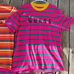 Guess Striped Mens T-Shirt! Spectacular Condition/Quality! Nwot No Holes, No Tears, No Rips, No Visible Stains, No Stress, No Stretching, No Fading, No Discoloration, No Discomfort Perfect For Any Streetwear Collector/Guess Mentor Like New Spring Pink T-shirt With Logo Print, Trendy Striped T-shirt With Letter Print, Multicolor Logo Print T-shirt For Spring, Striped Short Sleeve T-shirt With Letter Print, Pink Fun Top With Text Print, Pink Relaxed Fit T-shirt With Logo Print, Fun Pink Shirt With Text Print, Spring Striped T-shirt With Letter Print, Pink Crew Neck Top With Text Print