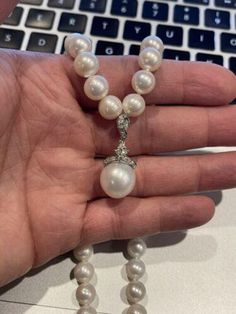 14k YG & 18k White Gold Round Pearl & Diamond Necklace24 Inches Center Pearl 13.5mm  8.5mm Pearls This is an timeless gold diamond and pearl necklace. If you have any questions or concerns please message me and I will get back to you as soon as possible! serial number: AJ0541536 A Fine Jewelry Akoya Pearl Necklace With 17 Jewels, Classic Pearl Diamond Necklace For Formal Occasions, Classic Formal Pearl Diamond Necklace, Luxury Pearl Necklace With 17 Jewels, Classic Diamond Necklace With Pearl Chain For Formal Events, Single Strand Diamond Bead Jewelry, Pearl Necklace For Anniversary, Luxury Diamond Necklace With Pearl Drop, Luxury Pearl Diamond Necklace For Wedding