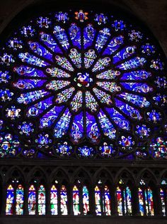 a large stained glass window in the middle of a building