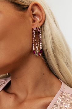 - Give your look a luxe feeling with these gorgeous earrings!
 - Featuring gold earrings with fuchsia and pink rhinestones in a fountain design 
 - Length: 2.5" Pink Rhinestone Drop Earrings, Pink Drop Earrings With Rhinestones, Glamorous Pink Earrings For Pierced Ears, Glamorous Pink Crystal Earrings With Sparkling Stones, Glamorous Pink Earrings, Glamorous Pink Pierced Earrings, Pink Jeweled Crystal Earrings, Pink Crystal Earrings With Sparkling Stones For Evening, Pink Jeweled Earrings For Party