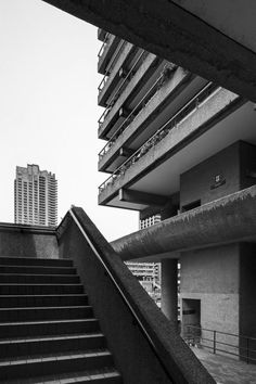 black and white photograph of stairs leading up to an apartment building