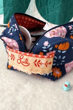 The little baby duck that was gifted to Lilo at a sewing retreat and now goes everywhere with her! See what else she keeps tucked inside of her sewing kit over on Shannon Fraser Designs' blog #whatsinyoursewingbag #sewingbag #notions