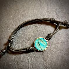 This beautiful Cherokee Nation bracelet is a unique piece of jewelry that embodies the spirit of the tribe. Crafted with a metal bezel and engraved wood, it is a stunning piece that is perfect for any occasion. The slip cord design adds a touch of rustic to the bracelet, making it a must-have for any jewelry collection. The bracelet is perfect for those who love nature, regional, and tribal jewelry, and it is sure to be a conversation starter wherever you go. Cherokee Indian, Engraved Metal, The Tribe, Metal Engraving, Cord Bracelet, Love Nature, Engraved Wood, Cord Bracelets, Oklahoma City