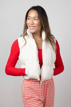 Look your best without sacrificing comfort in this Love Tree Crinkle Puffer Vest for Women in Cream. This vest features a cropped fit for a modern look that's perfect for any occasion. Enjoy the ultimate in fashionable warmth and comfort! Features: Love Tree Style: 5128VH-CREAM Color: Cream 100% Nylon Women’s vest Front side pockets Center front zipper Water resistant Puffer design with crinkle Slightly cropped fit Measurements from size small: Center Back Length: 17” Chest: 36” Hand wash cold, flat dry Trendy Fitted Puffer Vest, Cropped Fitted Winter Vest, Vest For Women, Love Tree, Cream Style, Look Your Best, Puffer Vest, Outerwear Women, Front Zipper