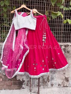 This is a made to order Lehenga Choli dupatta. I make it exclusively for my customers by using designer fabrics. Handling time, don't worry, just tell me, I will process it accordingly and deliver on or before a delivery date you mention. Fabric and Work: Lehenga made using in a hotpink velvet fabric. Mirrors are then pasted as handwork over lehenga. Blouse is made with white silk fabric having silver embroidery work. Dupatta is made in a matching color tone of lehenga. It has silver sequences and silver lace attached to it. One of my favourite outfit. Bridesmaid Bollywood Dupatta, Bollywood Style Lehenga Saree For Bridesmaid, Anarkali Bridesmaid Sets With Dupatta, Bollywood Style Bridesmaid Sets With Dupatta, Bollywood Bridesmaid Sets With Dupatta, Traditional Bridesmaid Lehenga With Zari Work, Traditional Floor-length Choli For Bridesmaid, Anarkali Choli For Bridesmaid Festive Occasions, Festive Anarkali Choli For Bridesmaids