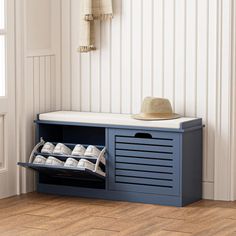 a blue shoe rack with shoes on it next to a white wall and wooden floor