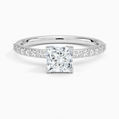 a princess cut diamond engagement ring with channel set shoulders