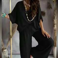 Black Two-Piece Set, V Neck Top Wide Leg Pants Oversize Style Size: Xxl Material: 95% Polyester 5% Spandex Condition: Nwot (Never Worn) Measurements Approx Top Pit To Pit: 30” Shoulder To Hem: 27” Pant Waist: 16.5” Un-Stretch & 25” Stretched Inseam: 28” Width At Hem: 16” Pet & Smoke Free Environment Tato Setengah Lengan, Celana Fashion, Solid Color Outfits, Color Outfits, Batwing Sleeve Top, Mid Waist Pants, Bat Sleeve, Jumpsuit Outfit, Blouse Pants