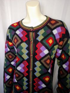 "VTG WOMEN MULTICOLOR CARDIGAN KNIT BLAZER SOFT WINTER CARDIGAN. Colorful cardigan with unique special designed buttons. Very soft lightweight button up sweater. Can be worn all year around. *Size: L *Acrylic *Perfect Condition Measurement: ( Please check the numbers ) *Shoulder: 20\" ( Lowered sleeve ) *Bust: 20\" *Hip: 21\" *Length: 34\" *Sleeve: 18\" Thank you for visiting my store. You can also visit my \" MargaretJewelryShop \"" Multicolor Wool Long Sleeve Cardigan, Vintage Multicolor Cardigan For Fall, Retro Long Sleeve Cardigan With Fair Isle Pattern, Multicolor Long Sleeve Sweater With Geometric Pattern, Multicolor Geometric Pattern Sweater For Fall, Retro Long Sleeve Fair Isle Cardigan, Multicolor Geometric Pattern Long Sleeve Sweater, Retro Fair Isle Cardigan, Vintage Multicolor Knit Cardigan