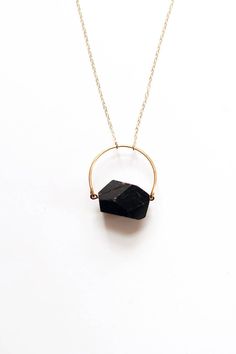 "Arch Black Tourmaline Necklace - Brass | Sterling Silver | 14k Gold Fill Featuring a black tourmaline nugget stone framed below a hammered arch accent in the metal of your choice. Due to the nature of the stone, each piece will vary slightly Length: 25\" chain (25\" chains have no clasps and slip right over the head) Designed & handcrafted in Richmond, VA USA MATERIAL OPTIONS: *brass arch with 14k gold filled chain *nickel silver arch with sterling silver chain *sterling silver arch and chain * Black Tourmaline Necklace, Raw Stone Jewelry, Diy Necklaces, Kitchen Witchery, Jewelry Staples, Tourmaline Jewelry, Tourmaline Necklace, Tourmaline Stone, Homemade Jewelry