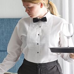 Highlight the sophistication of your establishment with this Henry Segal women's white tuxedo shirt with lay-down collar. Made from a high-quality 65/35 polyester-cotton broadcloth, this shirt does not sacrifice strength for comfort; it is both soft to the touch, providing comfort and breathability throughout shifts, and tightly-woven, capable of enduring the demands of daily commercial use. The blended material also resists wrinkling and shrinking and is machine washable, making it easy for you Vintage Tuxedo, Restaurant Uniforms, Reception Look, Tuxedo Shirt, White Tuxedo, Women Ties, Tuxedo Shirts, White Shirt, White Shorts