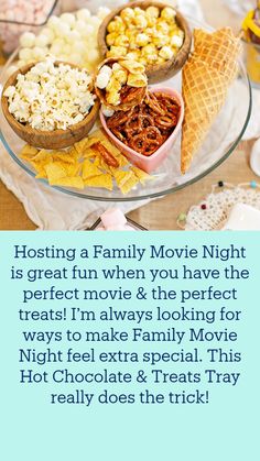 an ice cream sundae, popcorn and marshmallows on a glass platter