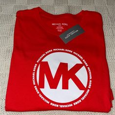 Designer Mk Michael Kors Bright Ruby Red 100% Cotton Tshirt Tee Shirt Loungewear Mens Size S, Michael Kors Fashion Tee. Brand New, Never Worn Or Used. No Rips, Tears, Or Defects. New With Tags. Feel Free To Message With Any Questions Or Concerns! Thanks For Looking !! Red Short Sleeve Tops With Logo, Red Crew Neck Top With Logo, Red Casual Shirt With Branding, Casual Red Shirt With Branding, Casual Red Tops With Logo, Red Short Sleeve Tops With Branding, Michael Kors Cotton Crew Neck T-shirt, Michael Kors Cotton Top With Logo Print, Michael Kors Cotton Crew Neck Top