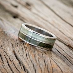 a wedding ring sitting on top of a wooden table