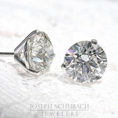 3 Prong Martini Stud Earrings with friction backs. Earrings will arrive assembled. Other back options are available. Popular stone choices include mined diamonds, lab-grown diamonds and moissanite, including Joseph Schubach exclusive Radiance® Moissanite. These timeless earrings are available in most stone qualities, sizes and stone types. Contact us for information. Round White Gold Lab Grown Diamond Earrings, Round White Gold Lab-grown Diamond Earrings, Platinum Round Diamond Earrings Fine Jewelry, Fine Jewelry Moissanite Diamond Earrings With Prong Setting, Fine Jewelry Diamond White Round Stone Earrings, Fine Jewelry Diamond Earrings With Round Stone, Fine Jewelry Diamond White Earrings With Round Stone, Diamond Earrings With Prong Setting, Diamond Cut Diamond Earrings