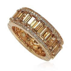 a yellow gold ring set with baguettes and diamonds