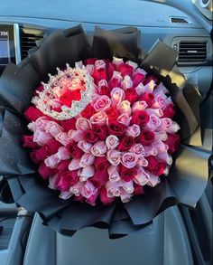 a bouquet of roses in the front seat of a car