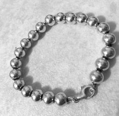 "This is a favorite style Sterling silver 8mm bead ball bracelet. Has lobster clasp closure for added security. Please note: Upto 1\" extender can be added at no additional cost. Must convo me, to let me know. Approx. 7\" Sterling silver bead ball bracelet Approx. 8mm Bead Ball size beads Approx. 14.3 grams REF: \"7\" Sterling Silver 8mm Bead Ball\" Bracelet" Classic Sterling Silver Bracelet With 8mm Beads, Classic Silver Beaded Bracelet Single Strand, Classic Silver Single Strand Beaded Bracelets, Classic Silver Single Strand Beaded Bracelet, Classic Bracelet With Round Beads And Lobster Clasp, Classic Silver Bracelets With 8mm Beads, Silver Single Strand Bracelet For Everyday, Everyday Silver Single Strand Bracelet, Nickel-free Classic Bracelets With Round Beads