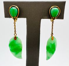 Unique Vintage 14K Yellow Gold Jade Tear Drop Dangle Leaf Earrings A perfect gift for your loved one for any special occasion or holiday!  Total Earring Weight: 5.26g Earring Length: 2 inches  Tear Drop Length: 0.527 inches Tear Drop Width: 9.65mm Leaf Length: 0.875 inches Leaf Width: 13.28mm These earrings are for non-pierced ears with screw backs.  Item will be placed in a gift box. * Tear Drop, Leaf Earrings, Pierced Ears, Unique Vintage, Ear Piercings, Jewelry Earrings Dangle, Etsy Earrings, Jade, Dangle Drop Earrings