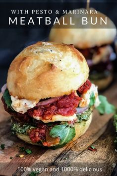 Two meatball buns with marinara sauce, pesto and gooey cheese on a cutting board. Pesto Meatball, Dagwood Sandwich, Meatball Sub Sandwiches, Pesto Meatballs, Meatball Sub Recipe, Vegetarian Sandwich Recipes, Vegan Burger Recipe, Pesto Vegan, Vegetarian Meatballs