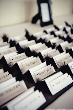 a computer keyboard sitting on top of a desk with lots of small tags attached to it