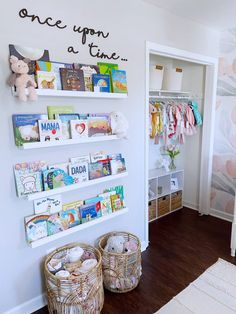 a child's room with bookshelves and baskets on the floor in front of it