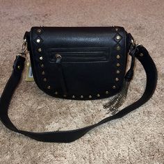 Great American Leatherworks Black Leather Bronze Studded Satchel Shoulder Bag 8.5"H X 9.5"W X 3.5"D Magnetic Snap Closure -- Removable Strap Outer-- Front Zipper Pocket, Back Pocket W/ Magnetic Snap Closure Inner-- 1 Zipper Pocket, 2 Media Pockets Comes With Adorable Chain Tassel Brand New With Tags & Beautiful! Fall Crossbody Shoulder Bag With Branded Hardware, Black Leather Shoulder Bag Fashion Accessory, Black Crossbody Satchel For Fall, Black Fall Crossbody Satchel, Black Crossbody Satchel, Black Faux Leather Crossbody Satchel, Fall Evening Shoulder Bag With Metal Hardware, Black Shoulder Bag With Metal Hardware For Fall, Black Bags With Metal Hardware For Fall