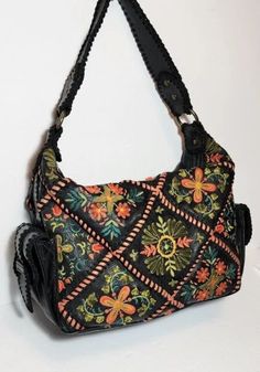 Embroidered Top Handle Shoulder Bag, Floral Embroidery Top Handle Shoulder Bag, Embroidered Satchel With Double Handle, Bohemian Floral Embroidery Shoulder Bag For Spring, Leather Shoulder Bag With Floral Embroidery, Black Embroidered Hobo Tote Bag, Bohemian Handheld Shoulder Bag, Bohemian Handheld Hobo Bag, Hand-stitched Travel Bags