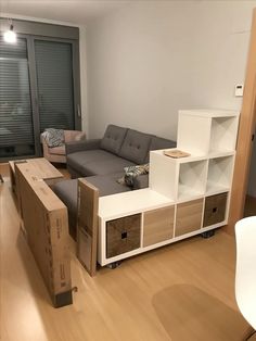 a living room filled with furniture and moving boxes