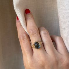 Metal: 14K Yellow Gold Finish: Matte Stone: Cabochon Tourmaline Stone Size: 11mm x 9 mm Stone Weight: 4.31 carat Band Width: 2mm bottom Blue Tourmaline, Tourmaline Stone, Cabochon Ring, Tourmaline Ring, Jewelry Inspo, Gold Finish, Tourmaline, Yellow Gold, Band