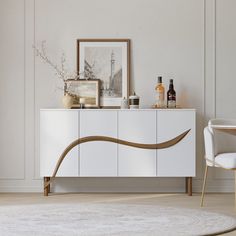 a white and gold sideboard in a living room