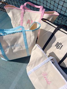 Your summer travel tote just got a whole lot cuter ;) Please pick between our four signature fonts! Embroidery is included in the price of the tote! Dimensions: 22.5x5.25x14.5inches CUSTOMIZATION, PLEASE READ: If Monogram Font please enter your initials in the order they should be monogrammed! Example: Kendall Leigh Beykirch is KBL (Last name in the center) + only pick one thread color! If colorblock please enter TWO initials MAXIMUM! + pick two thread colors If script or everyday font - please Spring Travel Embroidered Canvas Bag, Casual Embroidered Tote Beach Bag, Casual Embroidered Beach Bag, Summer Rectangular Bag With Embroidered Logo, White Canvas Bag For Spring Travel, Black Cotton Canvas Bag For Weekend, Cute White Canvas Travel Bag, Cute Spring Travel Canvas Bag, Embroidered Casual Canvas Bag For Summer