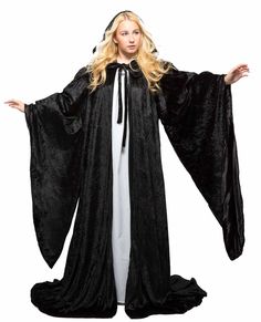 PRICES MAY VARY. Wizard Robe: This long, flowing robe is made from crushed poly-velvet; Its deep hood and oversized bell sleeves are fully lined in satin (the body of the robe is unlined); Hooded cape cloak has a yoked shoulder area, and the sleeves are gathered slightly onto the shoulders, giving an elegant and full, draped look; The hooded cloak wizard robe ties in front at the throat with a long tie made from the same velvet material as the body of the cloak Adult Robe with Hood and Sleeves: Black Cape With Hood, Kimono Photoshoot, Robe With Hood, Costume Family, Wizard Robes, Black Angel Wings, Cape Fashion, Carnival Costume, Black Angel