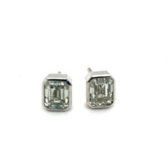 Offered here is a stunning pair of natural earth mined Emerald Cut Diamonds, weighing 2.05 carats total, averaging J in color and Vs in clarity.  Diamonds are bezel set in an elegant platinum bezel with an 18kt gold large pushback.   Bezel is 7.50mm by 6.50mm wide.  Stunning pair to enjoy everyday with casual jeans and they are chic for an evening gala.  Will easily become any lady's favorite pair of stud earring. Gia Certified Silver Baguette Cut Diamond Earrings, Gia Certified Silver Emerald Cut Diamond Earrings, Emerald Cut Platinum Diamond Earrings For Anniversary, Emerald Cut Platinum Earrings For Anniversary, Luxury Silver Diamond Earrings With Bezel Setting, Luxury Silver Earrings With Bezel Setting, Panther Ring, Evening Gala, Emerald Cut Diamonds