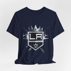 Los Angeles Kings Tee: Crown Your Game Day Look! Get ready to support the Los Angeles Kings in style with our eye-catching Kings Tee! Perfect for fans of all ages, this comfortable and trendy shirt features bold graphics that proudly display your team spirit. Whether you're at the arena or watching from home, this tee is essential for every Kings fan! Product Details: Material: Soft, high-quality fabric for ultimate comfort Fit: Classic fit that flatters every body type Design: Striking Los Angeles Kings graphics that make a statement Sizes: Available in a variety of sizes for kids and adults Whether you're cheering on your team at a game, hosting a viewing party, or just relaxing at home, this Los Angeles Kings Tee will keep you looking great while you show your support! Care Instructions Viewing Party, Los Angeles Kings, The Arena, Bold Graphics, Trendy Shirts, Just Relax, Type Design, Team Spirit, Game Day