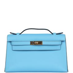 This Kelly Pochette is in Bleu Celeste swift leather with gold hardware and has tonal stitching, front flap, two straps with center toggle closure and a top flat handle.The interior is lined with Bleu Celeste lambskin and has an open wall pocket.Collection: BOrigin: FranceCondition: New and never worn (plastic on hardware) Accompanied by: Hermes box, Hermes dustbag, felt, carebook and ribbonMeasurements: 8.5" width x 5" height x 2.5" depth; 1" handle drop Kelly Pochette Outfit, Hermes Kelly Pochette, New Swift, Kelly Pochette, Mini Kelly, Open Wall, Hermes Box, Backpack Tote Bag, Handbag Wallet