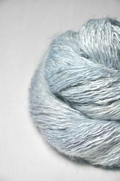 a skein of yarn on a white surface