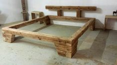 a wooden bed frame sitting on top of a floor