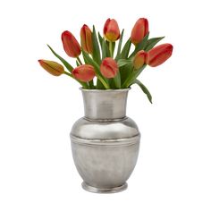 a silver vase filled with red and yellow tulips on top of a white background