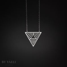 Triangular necklace- Beautiful triangle with circle stripes pendant, Featuring symmetrical  silhouettes.    ★ Comes in our signature gift box, ready for gift giving.  ★ Available in Silver [Sterling silver chain & silver plated pendant]  ★ Pendant size is: 1"x1". Thanks for shopping at ByYaeli♥  All images, texts & products are property of ByYaeli ©2020 Minimalist Silver Triangle Necklace, Minimalist Sterling Silver Triangle Necklace, Silver Triangle Necklace For Gift, Modern Silver Geometric Necklace, Minimalist Geometric Sterling Silver Necklace, Modern Triangle Jewelry For Gift, Geometric Silver Necklace For Gift, Silver Geometric Necklace For Gift, Triangle Jewelry