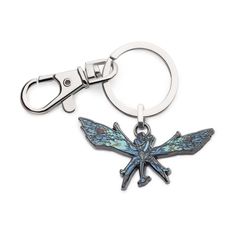 a keychain with a dragonfly design on it's front and back ends