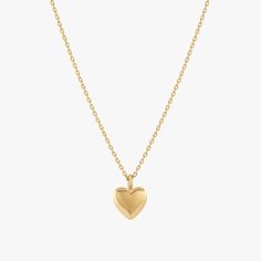 Hearts are the ultimate symbol of love. Show off your affectionate side with our Puffed Heart Necklace, featuring a rounded, puffy heart at the center of a classic chain. A wonderful gift for special occassions, this pendant necklace is a must-have you will be reaching for every day. - Gold plated over brass - Heart is approx. 0.8cm across - Adjustable length measures 16"-18" - Available in Yellow Gold only Elegant Heart Locket Necklace With Adjustable Chain, Elegant Heart-shaped Charm Necklace For Keepsake, Elegant Heart-shaped Keepsake Charm Necklace, Heart Pendant Locket Necklace For Valentine's Day, Classic Heart Necklace As Gift, Elegant Heart Necklace For Valentine's Day Keepsake, Valentine's Day Heart Pendant Locket Necklace, Classic Heart Charm Pendant Locket Necklace, Classic Heart Pendant Locket Necklace As A Gift