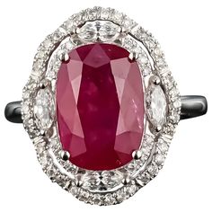 A stunning, certified, vivid red 5.40 carat Burmese heated Ruby and Diamond ring, set in 18K White Gold. The ring is currently sized at US size 7, and can be resized. The color of the center stone is ideal, and has great luster and is transparent. This deal is not to be missed, as this stone is a great investment! We provide free shipping, and accept returns. Please feel free to message us for more information! Exquisite Oval Ruby Ring Gia Certified, Luxury Marquise Red Ruby Ring, Luxury Red Marquise Ruby Ring, Marquise Red Diamond Ring, Elegant Gia Certified Ruby Ring, Red Diamond Ring With Brilliant Cushion Cut, Red Cushion Cut Brilliant Diamond Ring, Red Cushion Cut Diamond Ring With Brilliant Cut, Luxury Gia Certified Ruby Ring