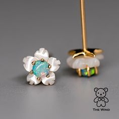 Small Flower Australian Solid Opal & Mother of Pearl Stud Earrings 18K Yellow Gold. Free Domestic USPS First Class Shipping! Free Gift Bag or Box with every order!Opal—the queen of gemstones, is one of the most beautiful gemstones in the world. Every piece of opal is unique in its own ways and patterns. We only use high-quality Natural Opals (NO synthetics or imitations) for our jewelry. ----------------------------------------------------------------------------------------------------ABOUT THI Luxury Flower Shaped Earrings As Gift, White Birthstone Earrings Fine Jewelry, White Flower Fine Jewelry Earrings, White Diamond Flower Earrings Fine Jewelry, Luxury White Flower Earrings, Luxury White Diamond Flower Earrings, Flower Shaped Gemstone Earrings As Gift, Fine Jewelry Gemstone Flower Earrings, Fine Jewelry Flower Earrings With Gemstones For Gift