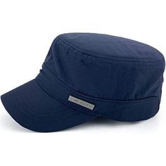 a blue hat that is sitting on top of a white surface and it has a name tag