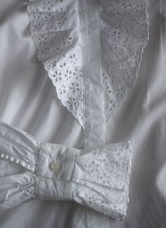 Vintage white lace women's blouse, from the 1990s era Victorian style, white blouse with a lavish ruffle lace front with eyelet floral embroidery and the same lace decorations on the cuffs. Slightly fitted body, looks great tucked into high waist jeans Material - missing tag, probably a cotton-polyester blend Size - marked 40 EU which is M. This is the vintage size, please look at measurements below to see if it will fit you: Approximate Measurements (taken when blouse lying flat, double armpit Summer Lace Blouse With Puff Sleeves, Elegant Spring Cotton Lace Top, Elegant Cotton Lace Top For Spring, Feminine White Blouse With Lace Patchwork, White Lace Patchwork Cotton Top, White Fitted Blouse With Lace Patchwork, Fitted White Blouse With Lace Patchwork, White Lace Top With Broderie Anglaise, Spring Cottagecore Blouse With Lace Collar