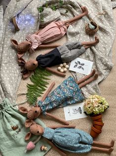 several stuffed animals laying on top of a bed