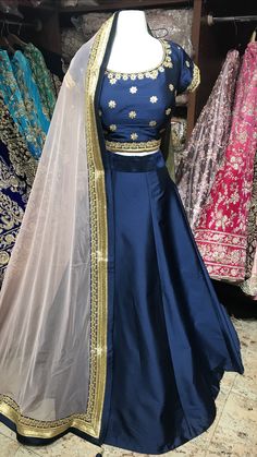 Order Your Bridesmaids Outfits Today Fabric - Tafetta Color - Navy & Blush Our bridesmaids outfits can be customized in multiple colors and specific to client measurements. They require 90 days of production time and are for bulk orders only! Orders are processed in store only! Minimum Order Quantity- 4 pieces Blue Party Wear Lehenga For Wedding, Blue Party Wear Sets For Wedding, Floor-length Wedding Dress With Gota Work, Fitted Satin Lehenga For Reception, Semi-stitched Satin Sets For Reception, Fitted Satin Choli With Dupatta, Bollywood Style Bridesmaid Lehenga, Fitted Bridesmaid Gown For Festive Occasions, Fitted Bridesmaid Sets