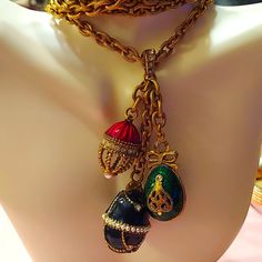 Farberge Enameled Eggs With Stones And Pearls In A Very Beautiful Chain. Vintage. Eggs Different Sizes. Color's Navy Blue, Red And Green. Goldtone Chain. Firm Price. Thank You To Lowballers Who Encouraged Me To Research, And I Had It Under Priced. Enamel Chain Jewelry For Gifts, Enamel Chain Jewelry As Gift, Enamel Chain Jewelry As A Gift, Unique Enamel Jewelry As Gift, Luxury Red Enamel Necklaces, Unique Enamel Charms Jewelry, Elegant Enamel Chain Jewelry, Handmade Enamel Jewelry For Formal Occasions, Elegant Enamel Necklace With Adjustable Chain